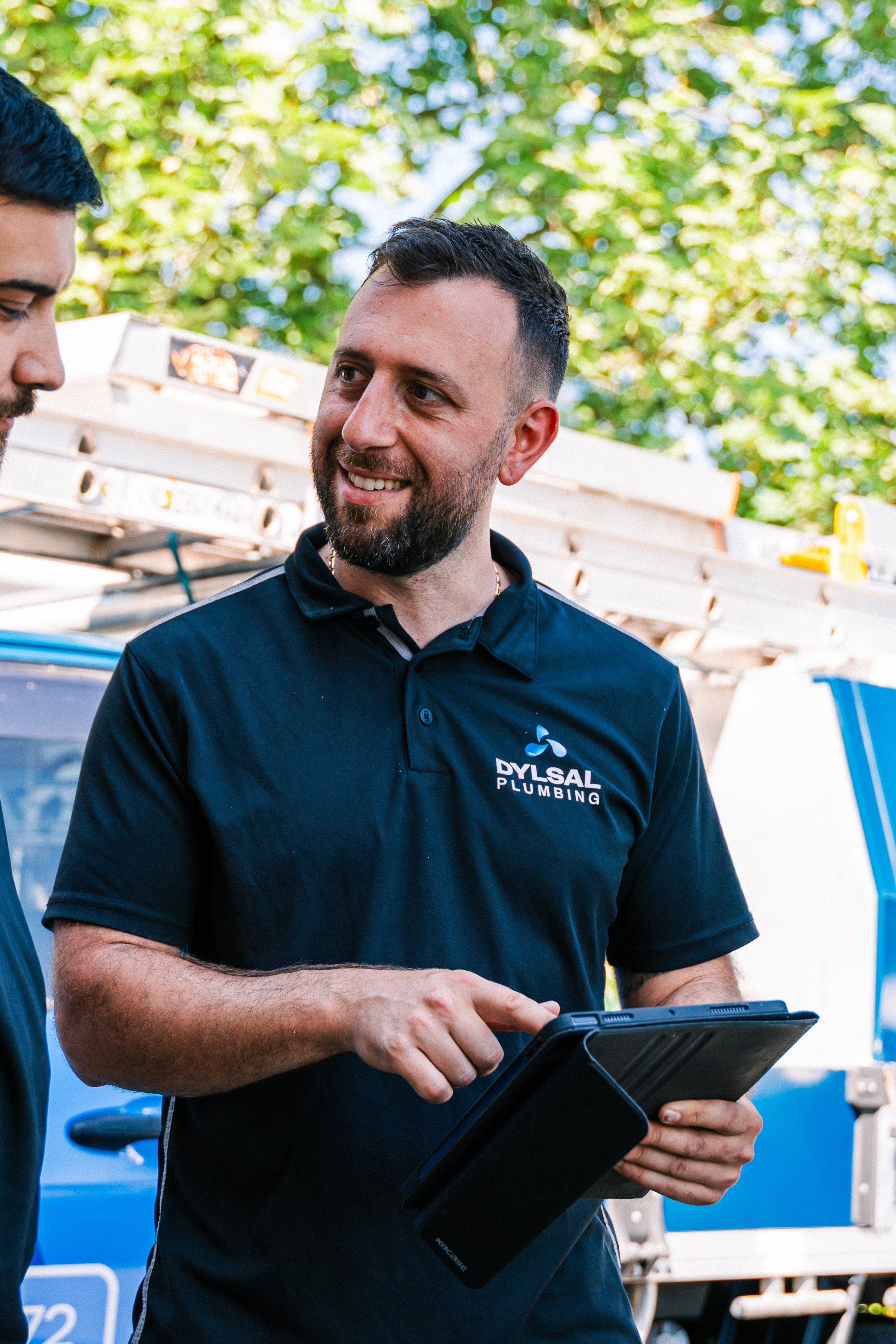 DYLSAL plumber reviewing CCTV footage with the customer